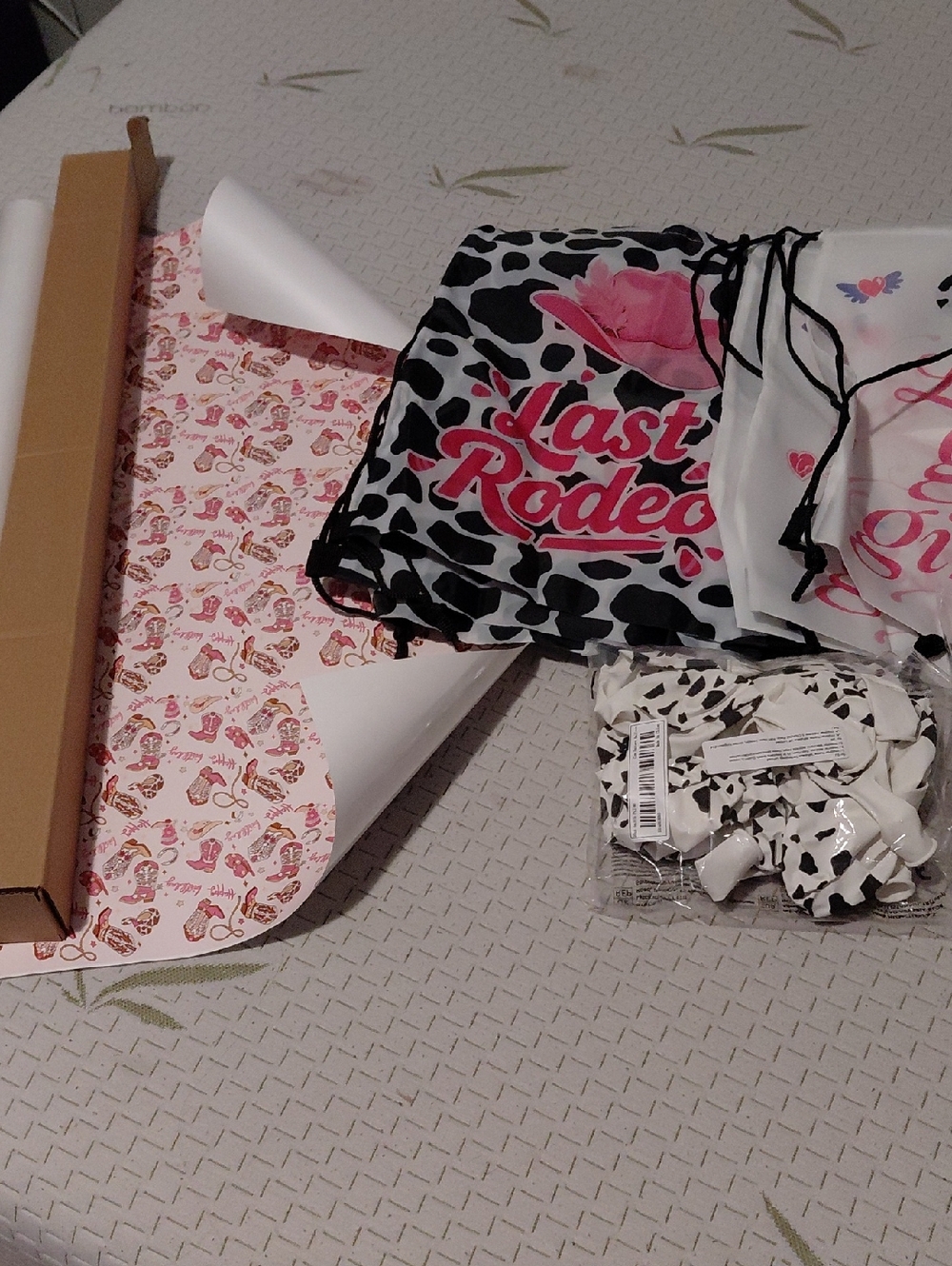 Last Rodeo Cow Print Drawstring Tote with Pink Logo